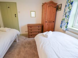 A bedroom with two beds and furniture at Deben Road in Woodbridge