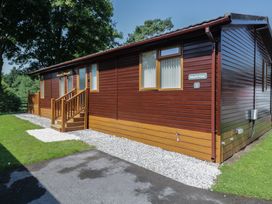 An outdoor view of a cabin with steps and a pathway at Wally's Folly near Limefitt Park