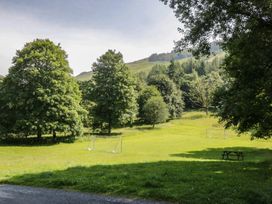 A park with trees and goalposts at Wally's Folly Limefitt Park near Troutbeck