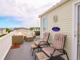 An outdoor terrace with seating at Park Lane in New Quay