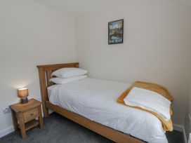 A bedroom with a bed and nightstand at Glandwr House Crossgates near Llandrindod Wells