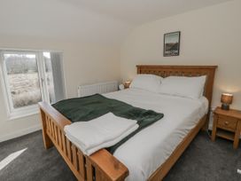 A bedroom with a double bed and bedside tables at Glandwr House Crossgates near Llandrindod Wells