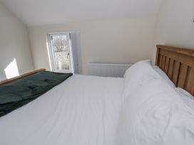 A bedroom with a bed and a window at Glandwr House Crossgates near Llandrindod Wells