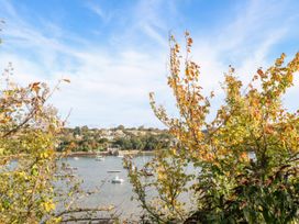A view of water with boats and trees at The Cow Shed in 