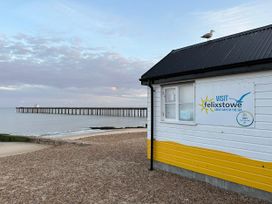 A beach hut and pier at Felixstowe in Felixstowe, Suffolk