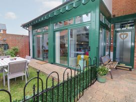 A garden with a dining table and chairs at Old Felixstowe, Bath Road, Felixstowe, Suffolk
