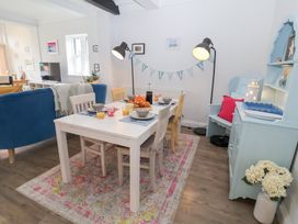 A dining room with a table set for breakfast at Old Felixstowe, Bath Road in Felixstowe, Suffolk