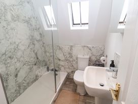 A bathroom with shower, toilet, and sink at Old Felixstowe, Bath Road, Felixstowe, Suffolk