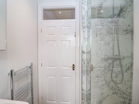 A bathroom with a shower and towel radiator at Old Felixstowe, Bath Road, Felixstowe, Suffolk