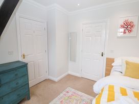 A bedroom with a bed and dressing table in Old Felixstowe, Bath Road, Felixstowe, Suffolk