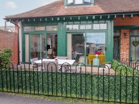 An outdoor area with a table and chairs at Old Felixstowe, Bath Road, Felixstowe, Suffolk