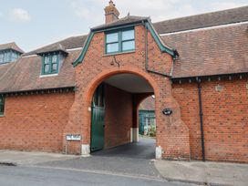An archway leading to a pathway at The Mews in Felixstowe, Suffolk