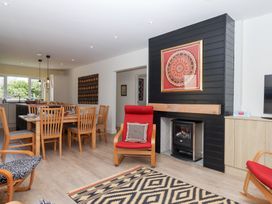 A dining room with a table and chairs at Clova Brixham