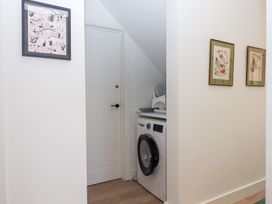 A laundry room with a washing machine at Clova in Brixham