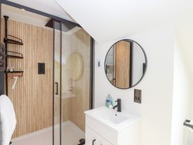 A bathroom with a shower and sink at Clova in Brixham