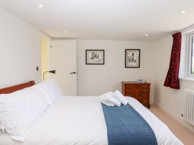 A bedroom with a bed and chest of drawers at Clova in Brixham