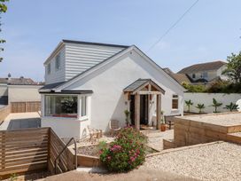 A house with a garden and pathway at Clova in Brixham