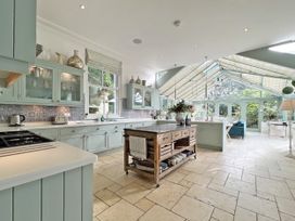 A kitchen with cabinets and a large island at Trenare in Truro