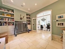 A dining room with a table and chairs at Trenare in Truro