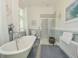 A bathroom with a bathtub and shower at Trenare in Truro