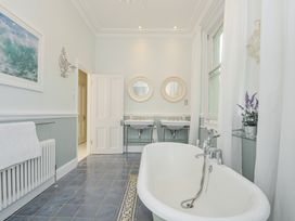 A bathroom with a bathtub and sinks at Trenare in Truro