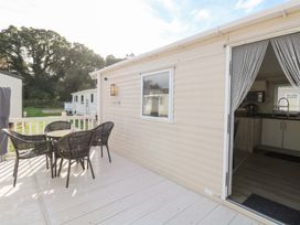 An outdoor seating area with table and chairs at Number 34 Foxburrow Hang in Great Yarmouth