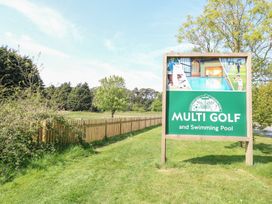 A sign for Multi Golf and Swimming Pool at Number 34 Foxburrow Hang in Great Yarmouth