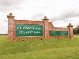 A sign for Caldecott Hall Country Park with amenities listed at Caldecott Hall Country Park in Great Yarmouth