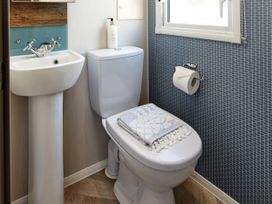 A bathroom with a sink and toilet at Island Breeze - Hayling Island