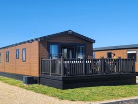 A mobile home with a deck at Harbour Haven - Hayling Island