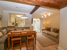 A dining room with a table and chairs at The Cottage in Stow-On-The-Wold