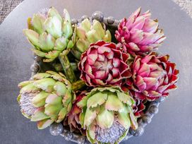 A bowl of artichokes on a table at Forest Lodge in Pontyclun