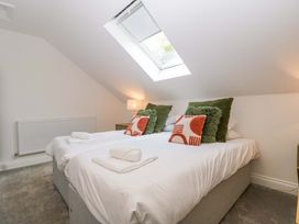 A bedroom with two twin beds at Forest Lodge in Pontyclun