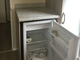 A refrigerator with ice cubes and a countertop at 38 The Green