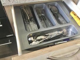 A drawer with cutlery and kitchen utensils at 38 The Green