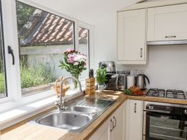 A kitchen with sink and countertop at Rigg Cottage in Sandsend