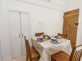 A dining room with a table set for breakfast at Rigg Cottage Sandsend
