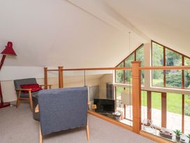 A living room with a sofa and television at Lawnswood