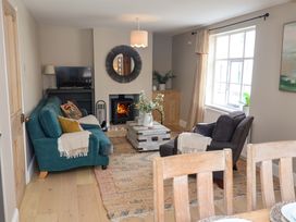 A living room with a sofa and coffee table at 11 Ballygate in Babbacombe