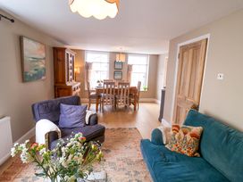 A living room with furniture including a sofa and dining table at 11 Ballygate in Babbacombe