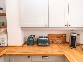 A kitchen with a kettle and toaster on the counter at 11 Ballygate in Babbacombe
