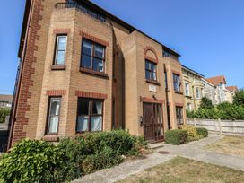 A brick building with windows and a front door at Flat 9 in Swanage