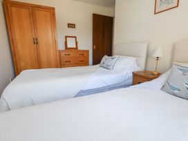 A bedroom with two beds and furniture at Flat 9 in Swanage
