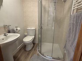 A bathroom featuring a sink, toilet, and shower enclosure at The Studio in Marsham near Aylsham