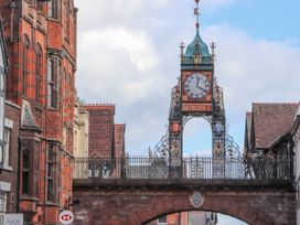 A clock tower in a street setting at The Garden Hut in Wrexham
