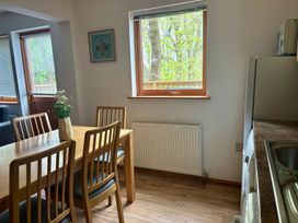 A dining room with a table and chairs at Acorn Lodge Finlakes Holiday Park near Chudleigh