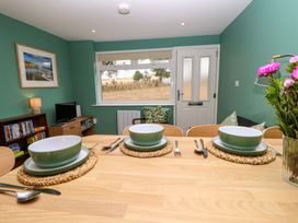 A dining room with a table set for meals at No 157 Sandown Bay Holiday Chalet 'Field View' Sandown