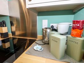 A kitchen with kettle and coffee maker at No 157 Sandown Bay Holiday Chalet 'Field View' Sandown