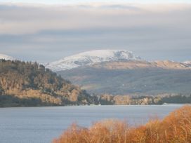 A lake with mountains in the background at Norwood House in Ambleside