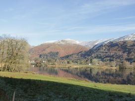 A landscape with mountains and a lake near Norwood House in Ambleside